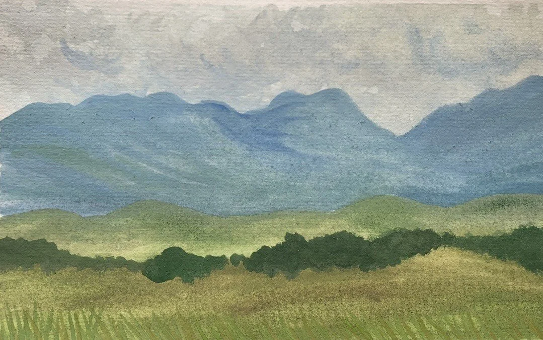 A watercolor painting of green hills in the foreground and blue mountains in the background under a pale sky.