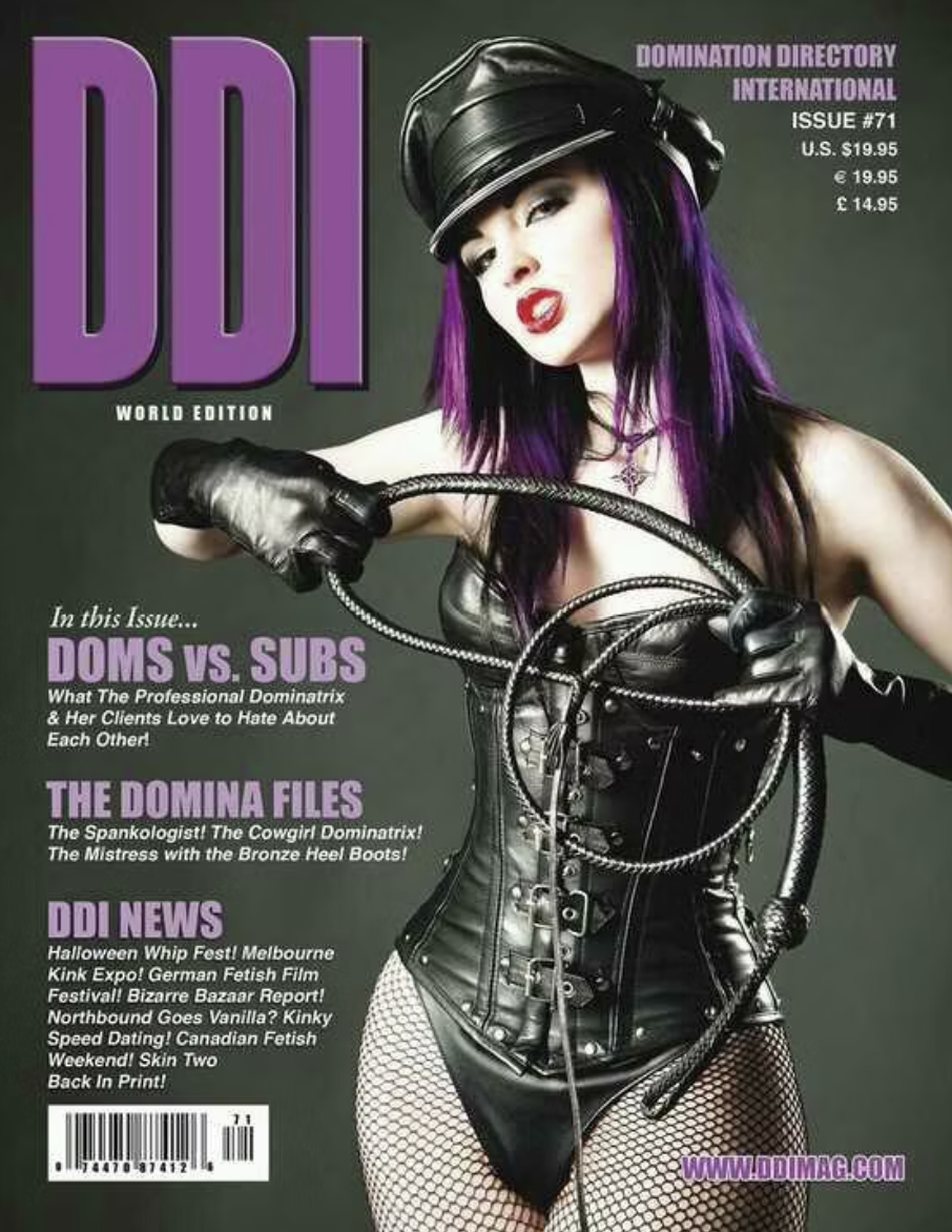 Magazine cover featuring a woman with purple and black hair, wearing black leather outfit, fishnet stockings, gloves, and a cap, holding a whip. The magazine is titled "DDI World Edition" and includes headlines about BDSM themes, domination, and feti