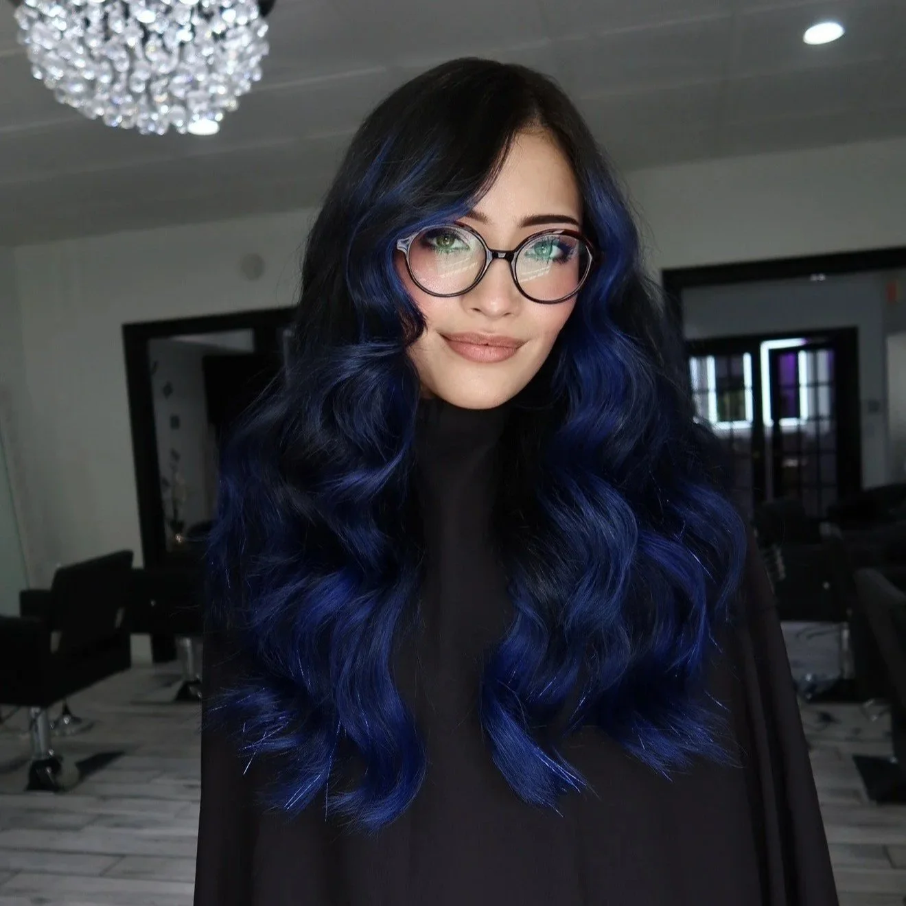 Blue hair with two rows of hand tied wefts done at Salon Amoura Orlando, Florida