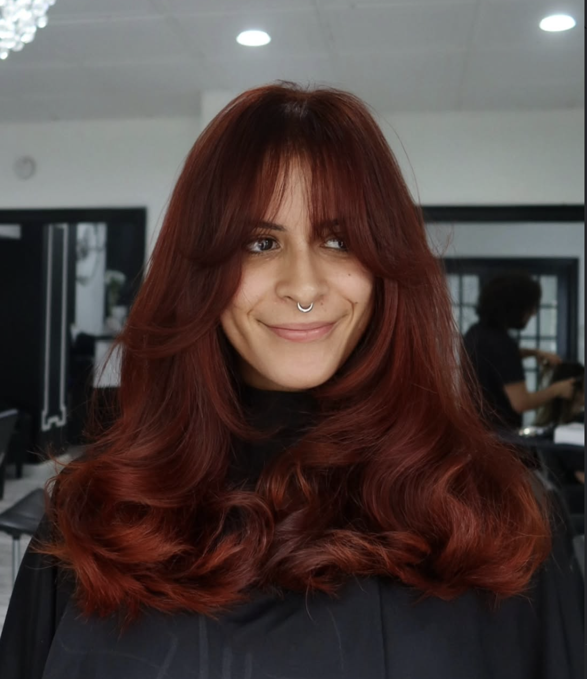 a riech red brown by Salon Amoura, an Orlando hair salon specializing in custom color and luxury hair extensions near UCF and Waterford Lakes.