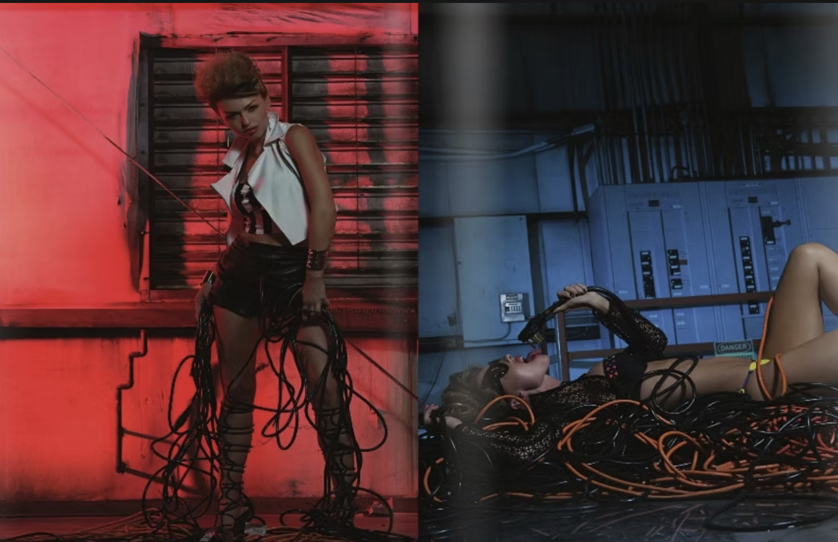 Two women in provocative poses, one standing with red lighting and the other lying on the floor with blue lighting, surrounded by computer cables and wires in an industrial setting.