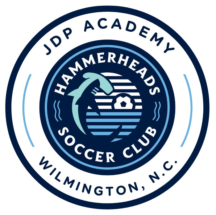 Logo of JDP Academy Hammerheads Soccer Club in Wilmington, NC, featuring a hammerhead shark and a soccer ball surrounded by text.