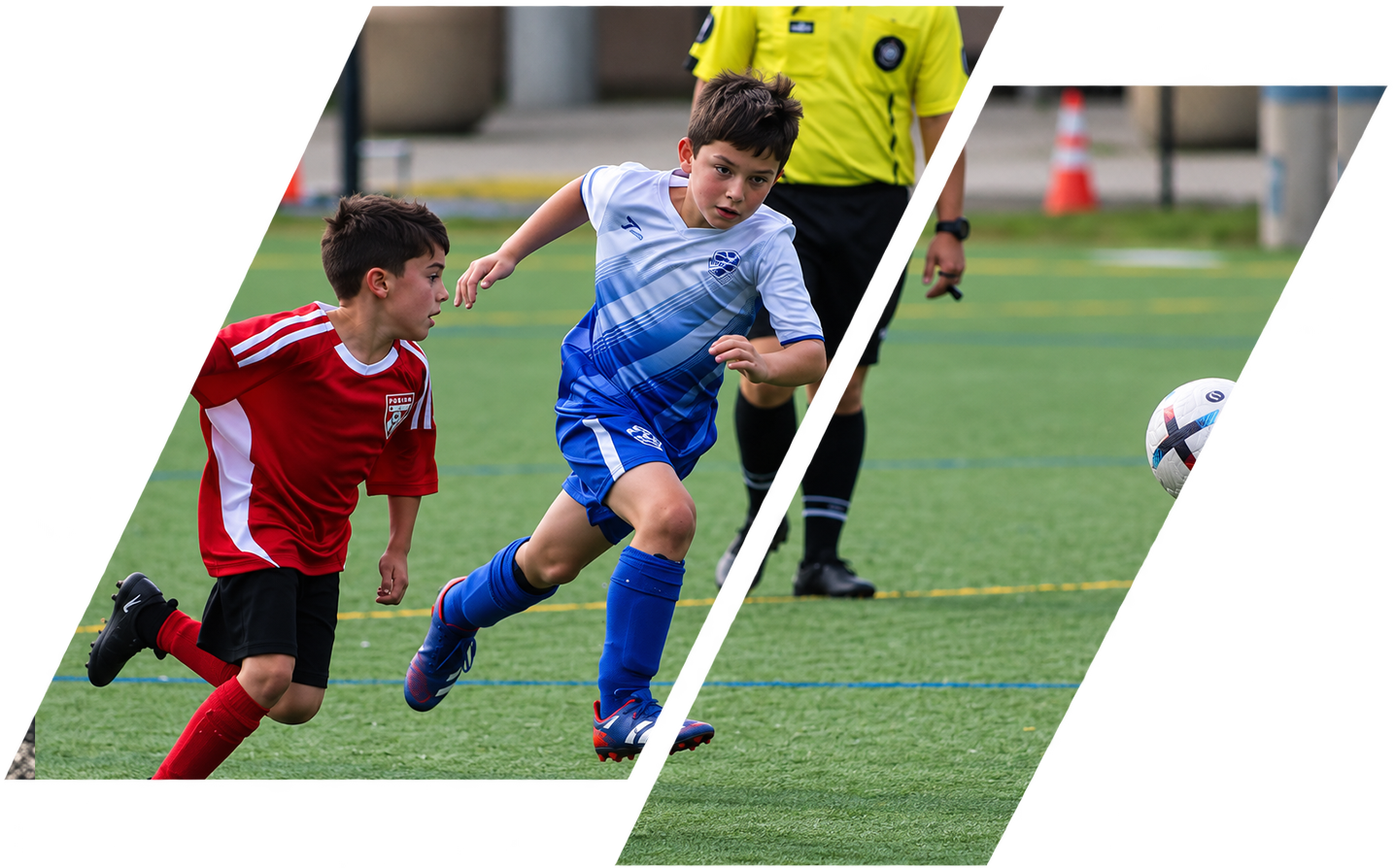 Two young boys playing soccer on a field with a referee in the background. One boy in a blue uniform is running toward a ball, while the other in a red uniform is following closely.
