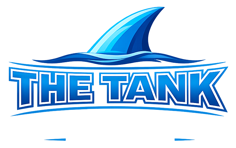 Logo for The Tank, featuring a blue shark fin above stylized text.