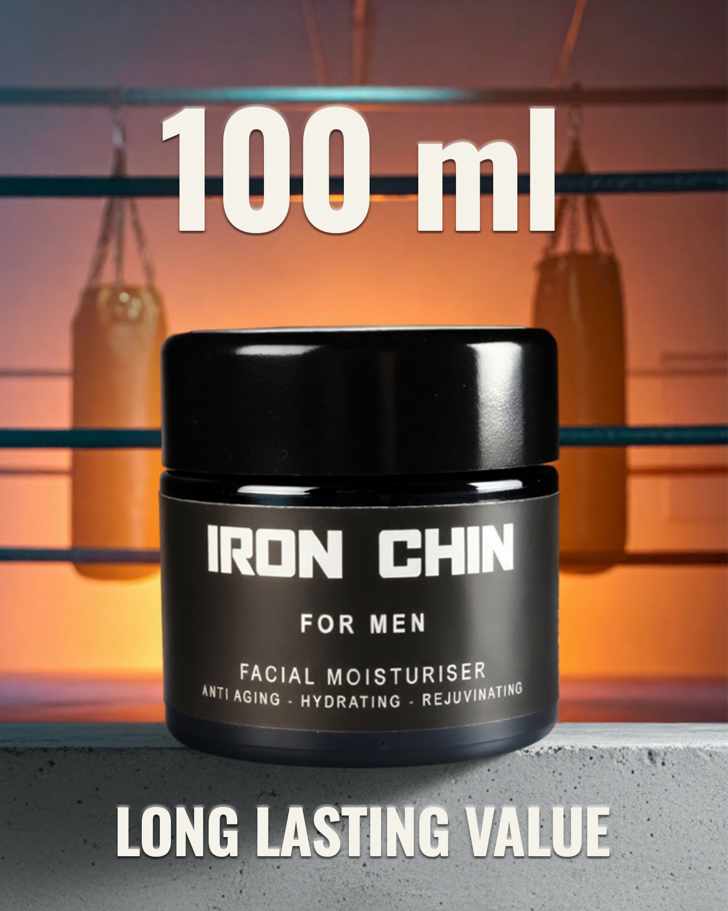 A black cosmetic of Iron Chin facial moisturiser. A boxing ring and 2 punch bags in the background. Large white text on the image states '100 ml' and 'LONG LASTING VALUE', and smaller text describes the product's benefits like a anti-aging.