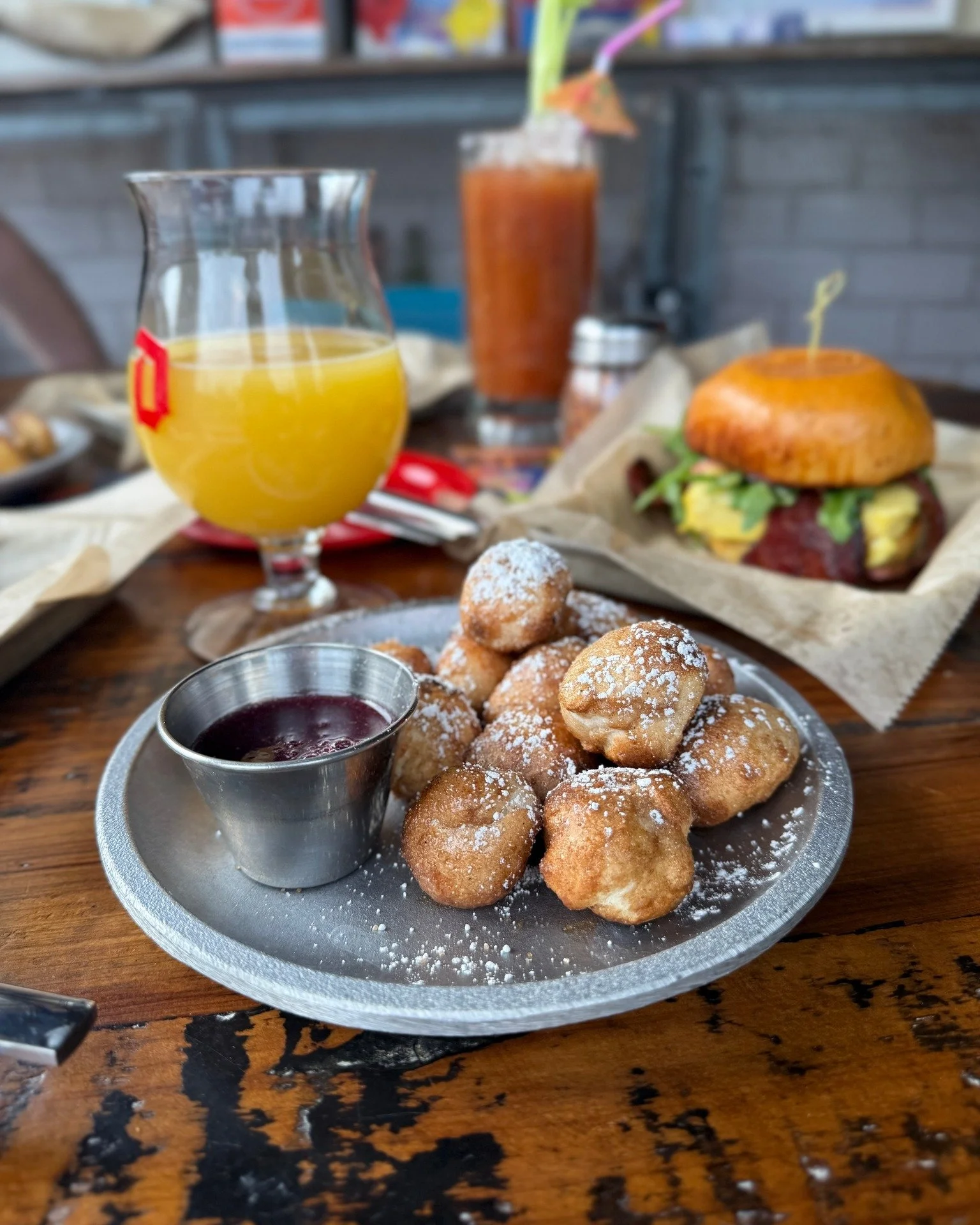 Warning: Brunch cravings approaching at full speed. 🍀🏎️
St. Patrick&rsquo;s Day weekend calls for a pit stop at Mid City Garage.

Start sweet with the Sugar Rush Hour. 🚦
Golden puffs dusted in cinnamon and sugar, served warm with hot honey and a b