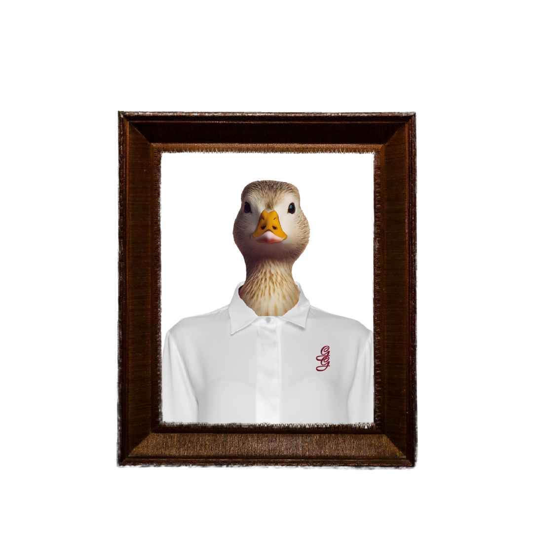 A framed photo of a person with a duck's face, dressed in a white shirt with red embroidery, against a black background.