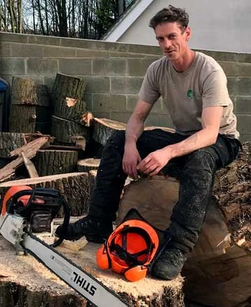 Adam King, tree surgeon in Brighton with chainsaw and equipment