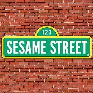 Sesame Street street sign with brick wall background