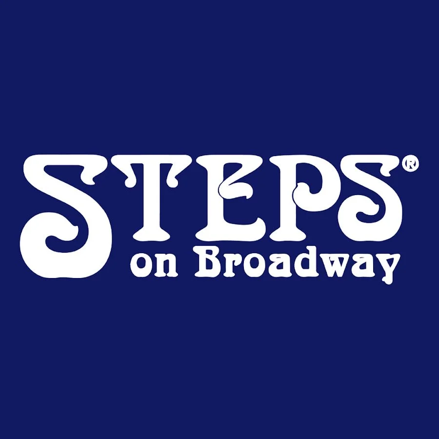 Logo for 'Steps on Broadway' featuring the name in stylized white letters on a dark blue background.