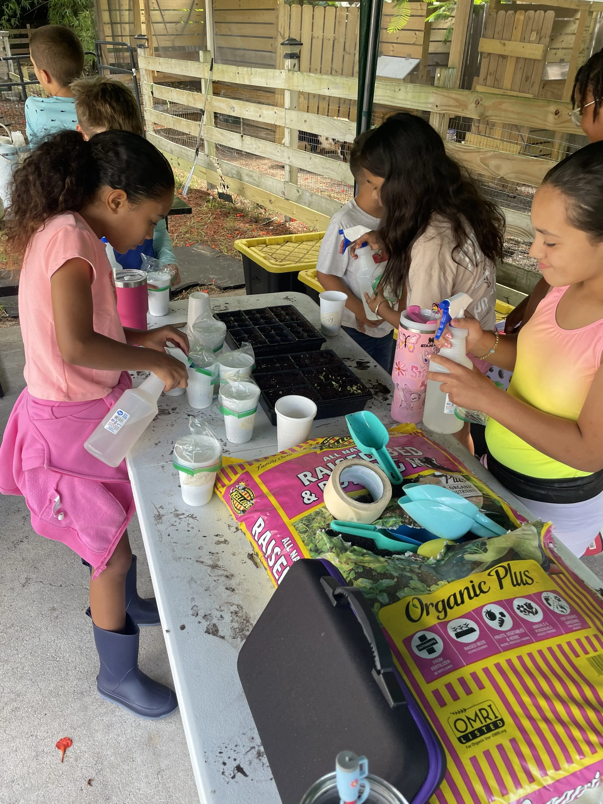 kids planting seeds.jpeg