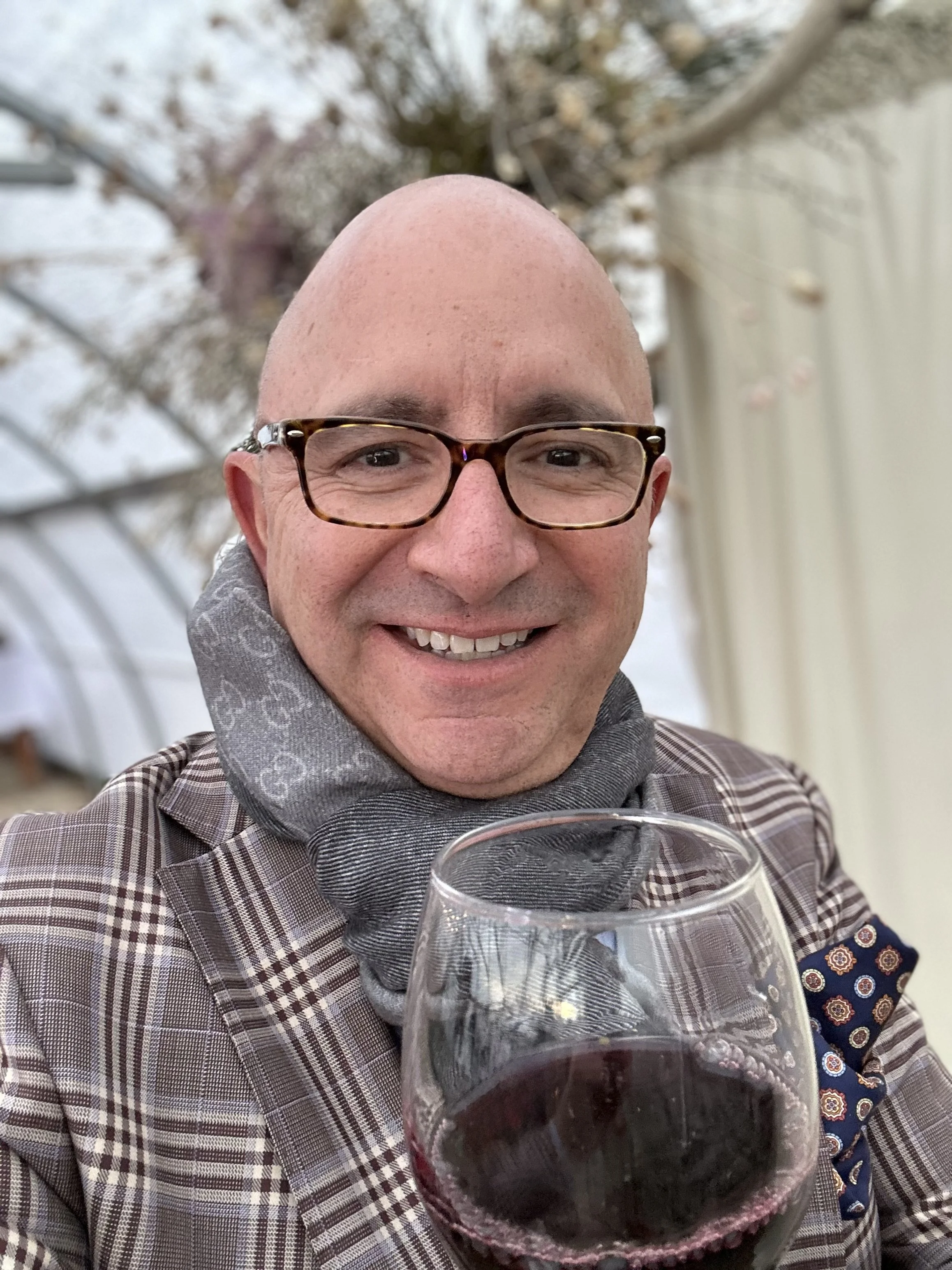 David Rodriguez, WhereRenoEats founder and Reno Tahoe food writer, with a glass of red wine — Reno News and Review columnist and Edible Reno Tahoe contributor