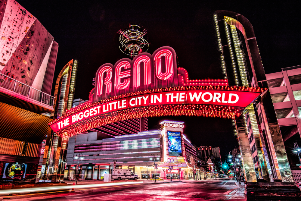 Reno Nevada arch sign at night reading The Biggest Little City in the World — WhereRenoEats Reno Tahoe restaurant guide