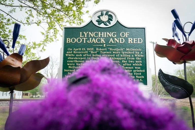  View of Talamieka Brice overlooking the historical marker for Bootjack and Red erected in the Duck Hill town square. Photo courtesy of Rory Doyle. 