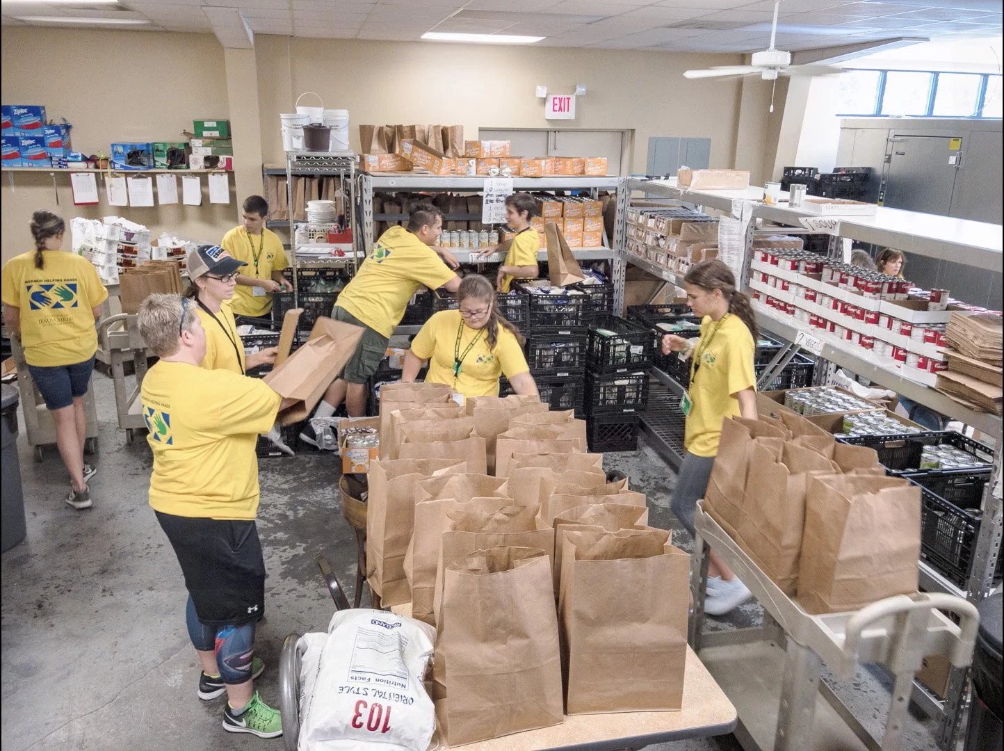 Extra Table volunteers packing food