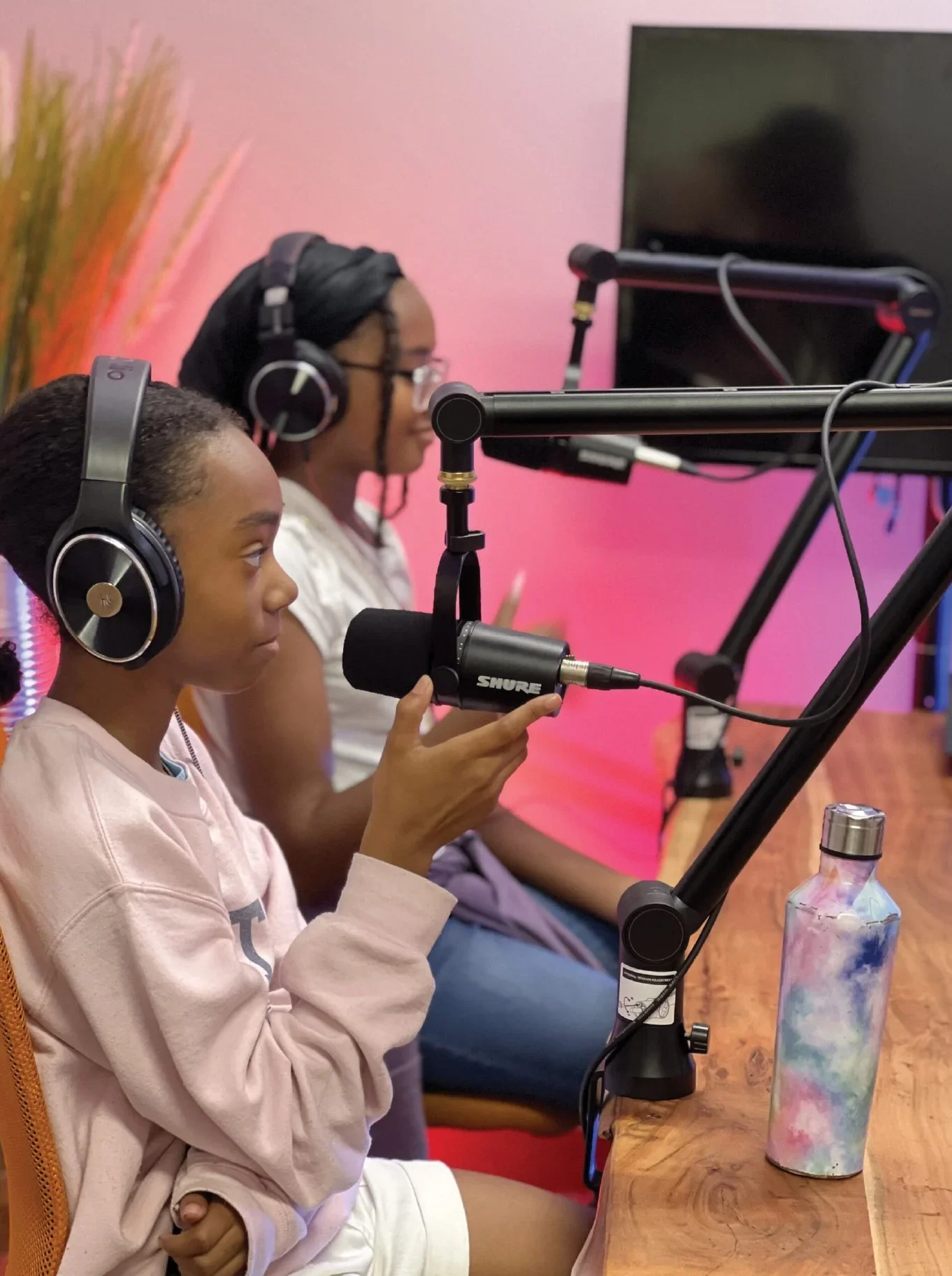 Two young girls record a podcast in a studio. | Young Futurists Project | Community Foundation for Mississippi Grants
