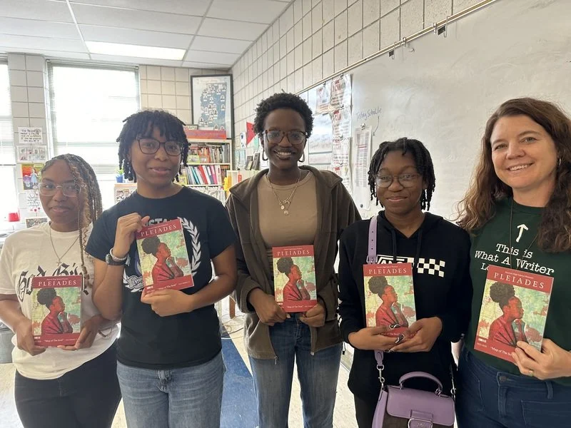 Students hold copies of Murrah Pleiades.