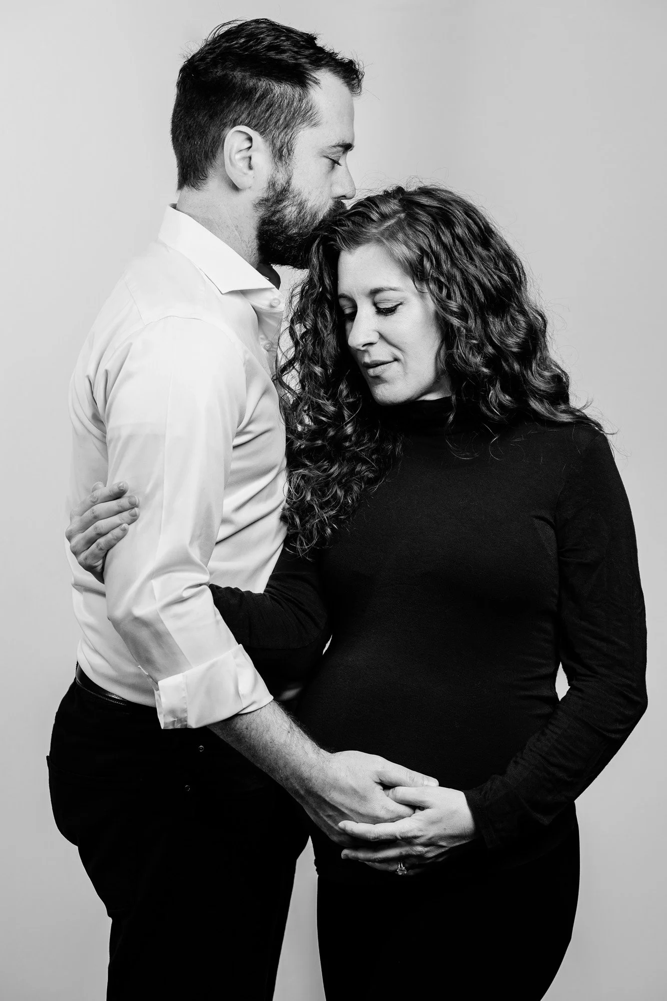 black and white portrait of a pregnant woman and man