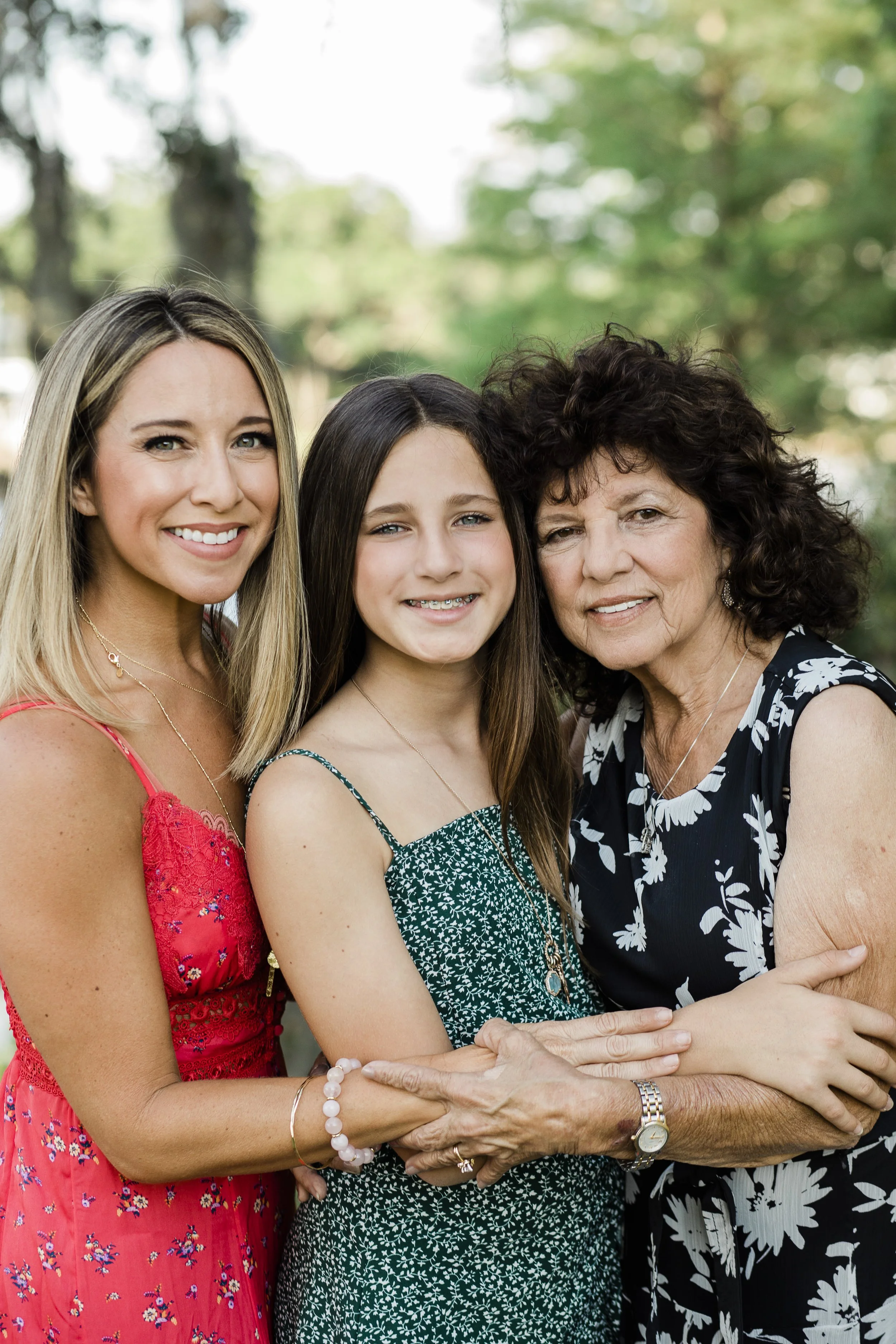 Three generations of women embrace