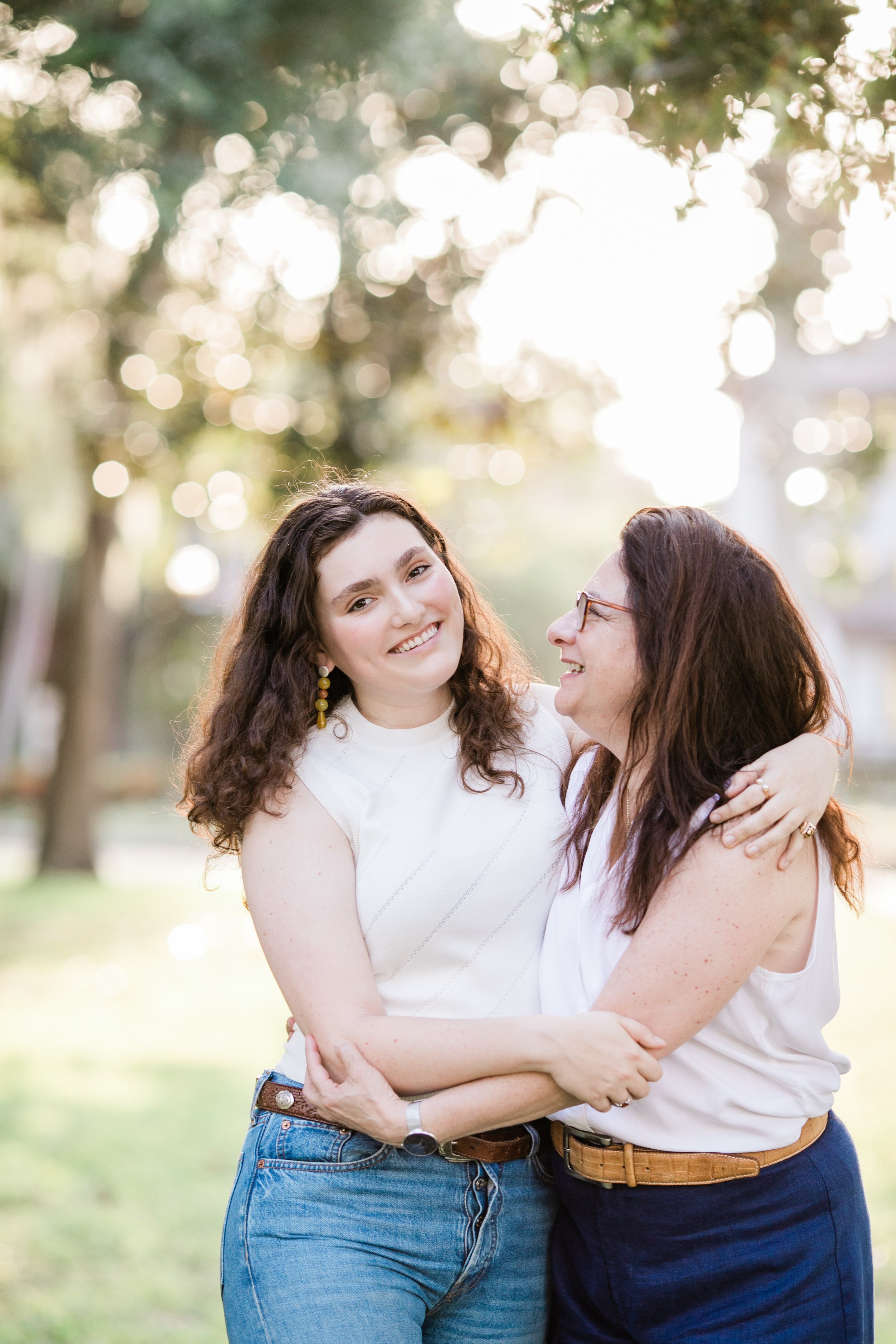 mother and daughter embrace for college graduate portrait in St. Petersburg, FL