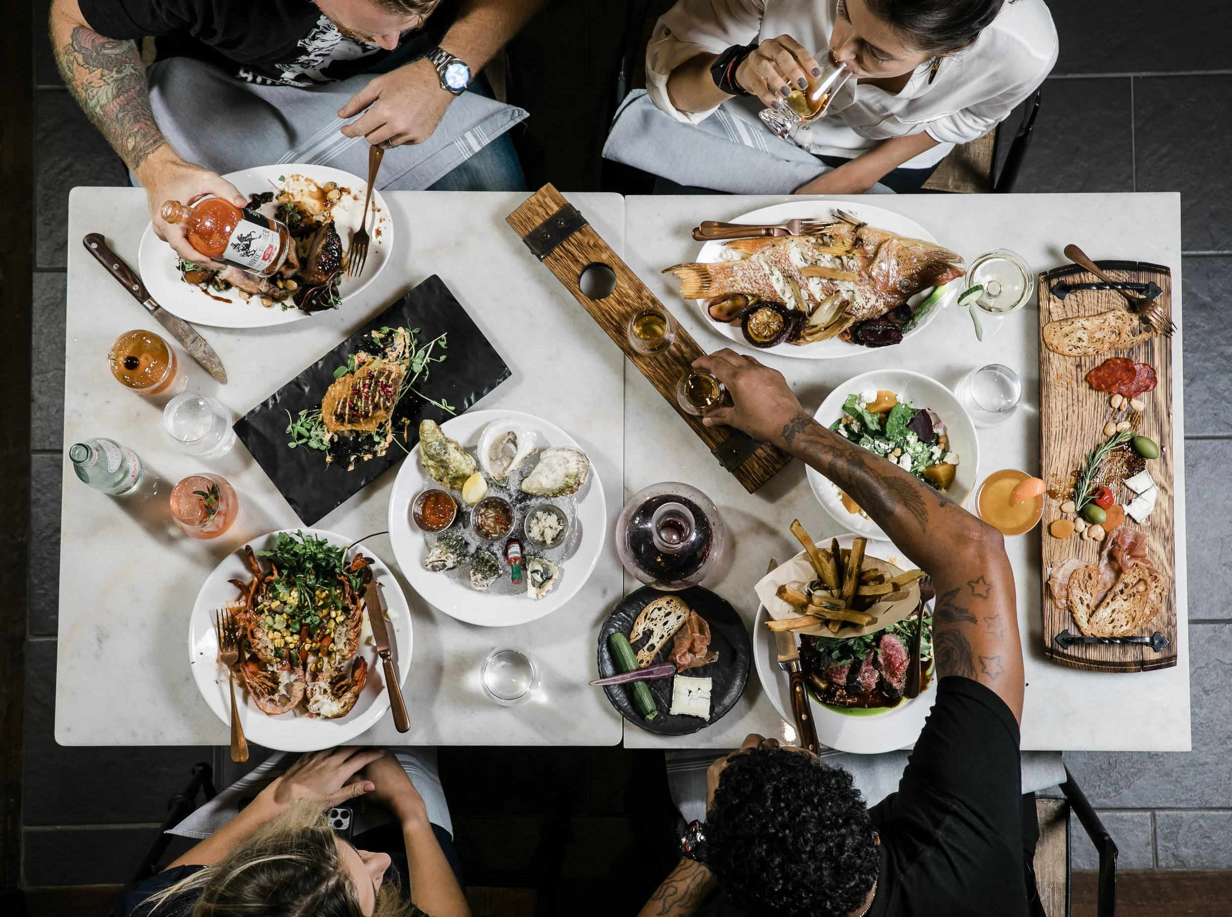 overhead shot of a meal in process at Urban Stillhouse, St. Pete
