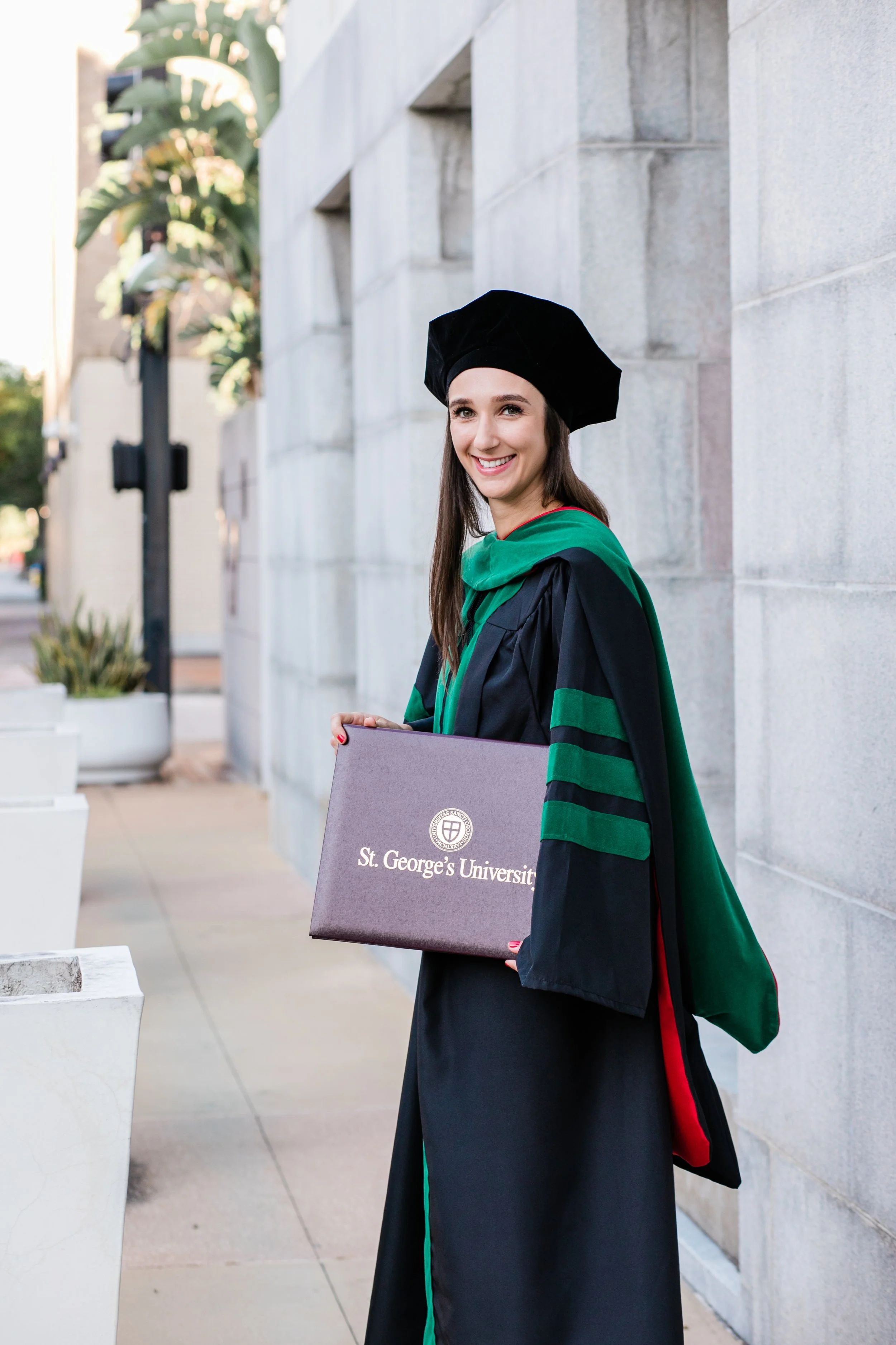 St. George University doctoral graduate in cap and gown