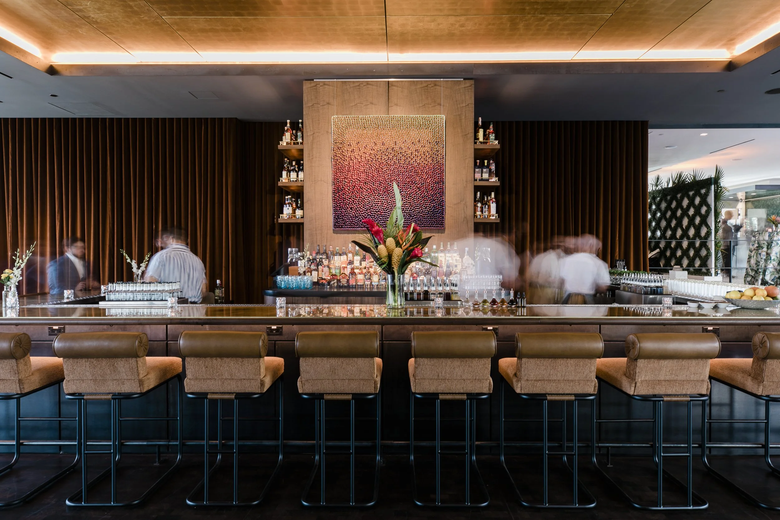 bar at Hotel Hays with blurred people
