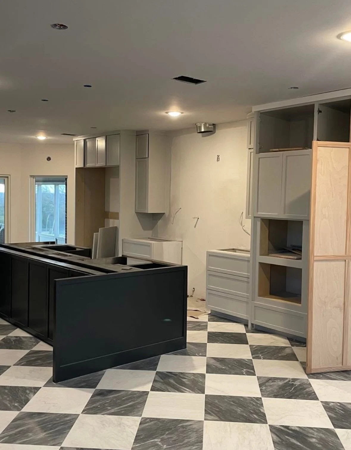Modern Farmhouse kitchen construction with marble tile floor checkered by Opal & Oak McKinney Texas