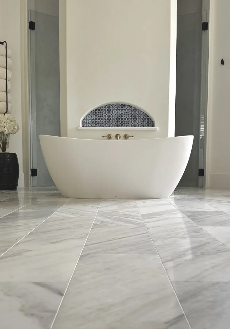 spanish handmade tile and free-standing tub with calacutta tile floor and tadelakt shower by Opal & Oak