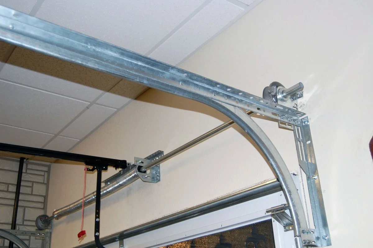 how-to-adjust-garage-door-tracks-1696405454-1288781336.jpg