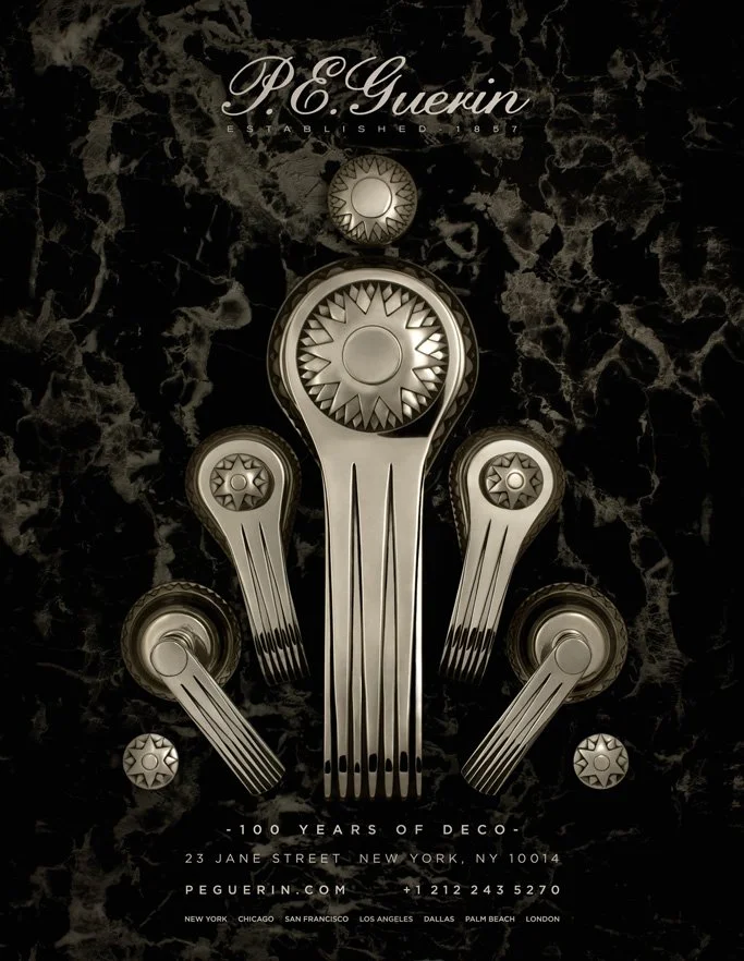 Advertisement for P.E. Guerin featuring metallic decorative hardware on a dark marble background.