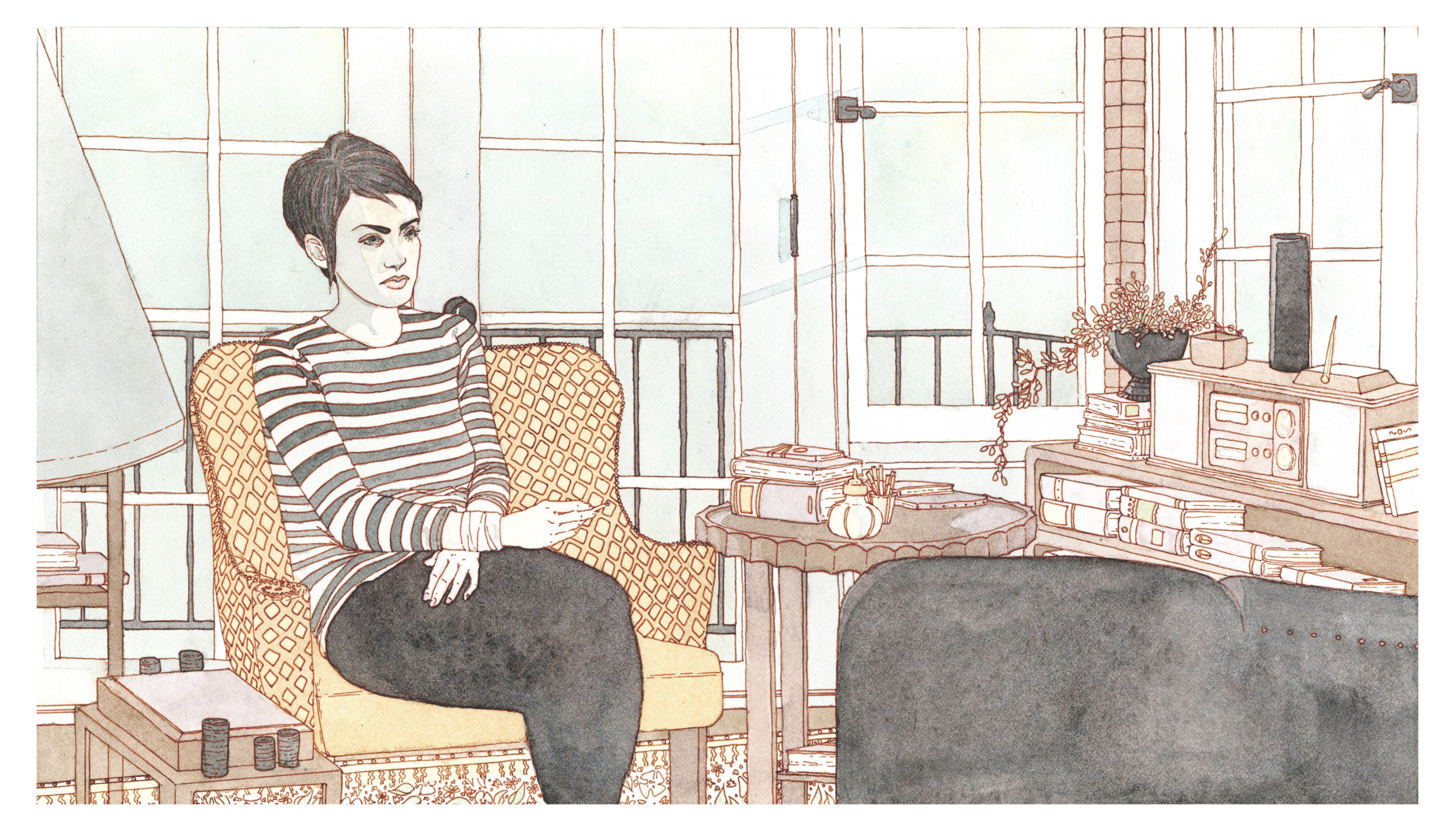 A woman with short dark hair sitting on a yellow patterned armchair in a cozy room, holding a remote control. The room has large windows with a balcony railing, a side table with poker chips, and a shelf with books, a plant, and various electronics.