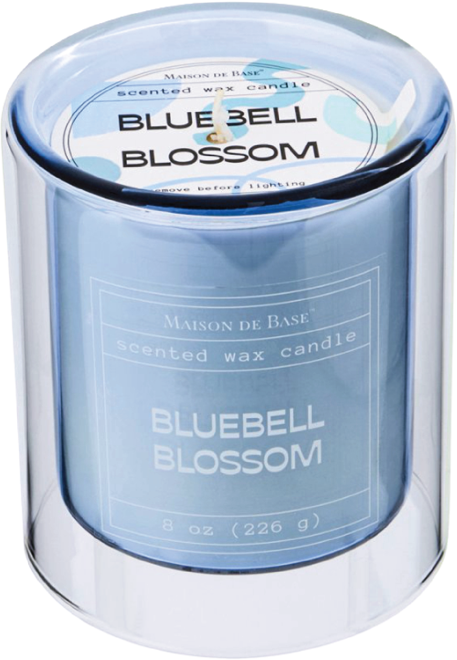 A scented wax candle in a cylindrical container labeled "Bluebell Blossom," with a visible wick and a light blue design on the label.