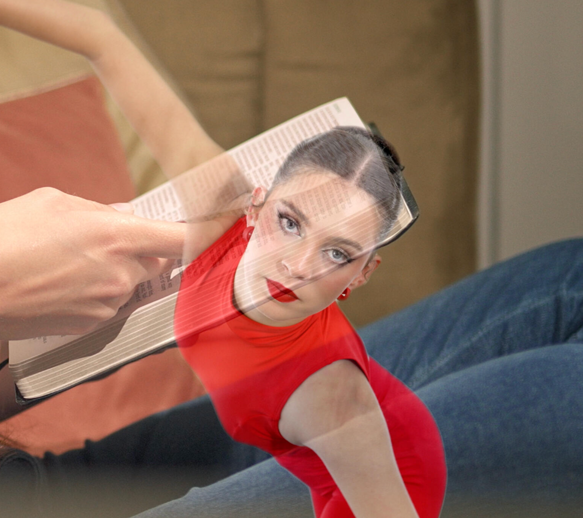A woman in a red top lying on a couch with a book and a transparent overlay of her face.