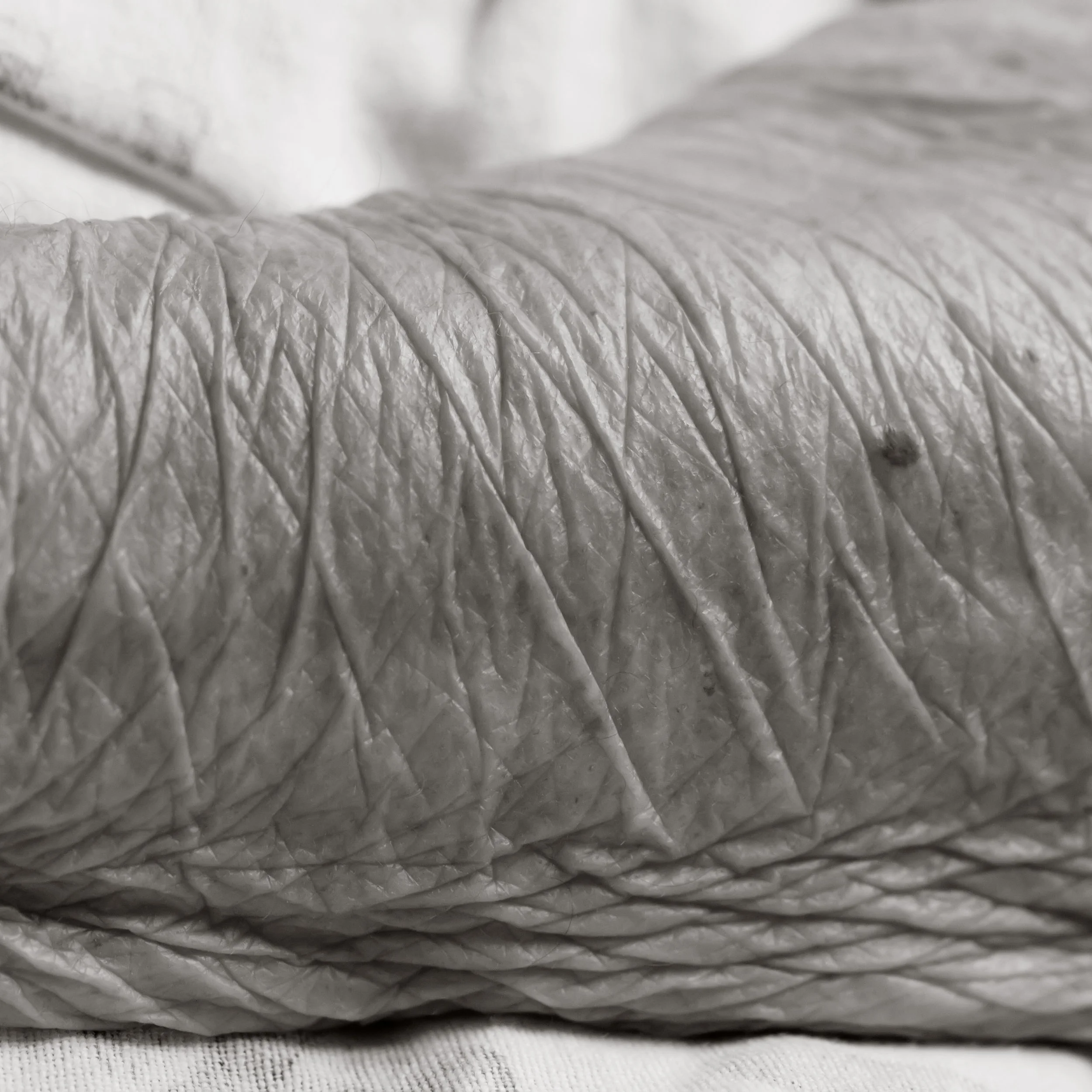 Close-up of a human arm with folded, wrinkled skin.