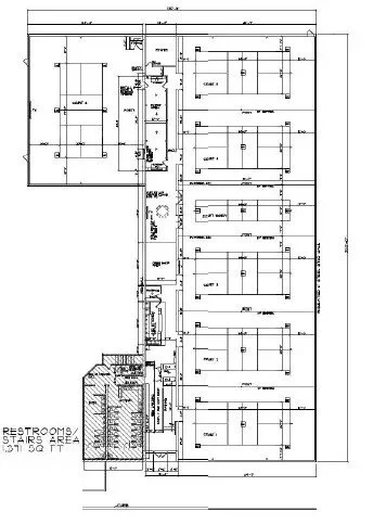 Detailed architectural floor plan of a public restrooms and stair area, including multiple labeled rooms, hallways, and structural elements.