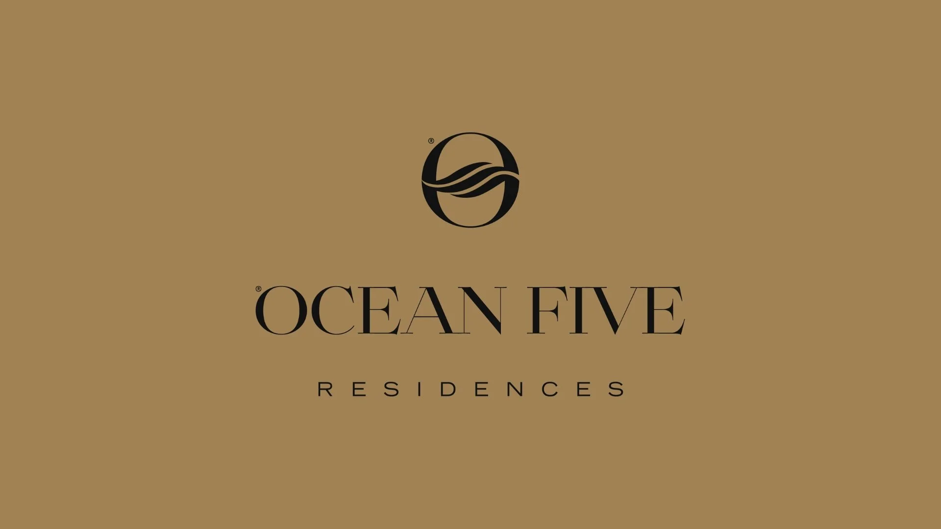 A gold-colored background with a black oval logo featuring wavy lines, and the text 'OCEAN FIVE RESIDENCES' in black capital letters.