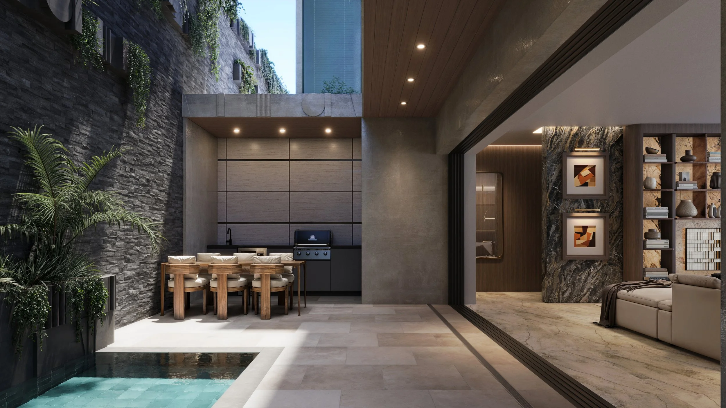 Modern indoor living space with open kitchen, dining area, and living room, featuring stone and wood finishes, indoor plants, built-in shelves with decorative items, and large glass sliding doors leading to an outdoor area with a pool.