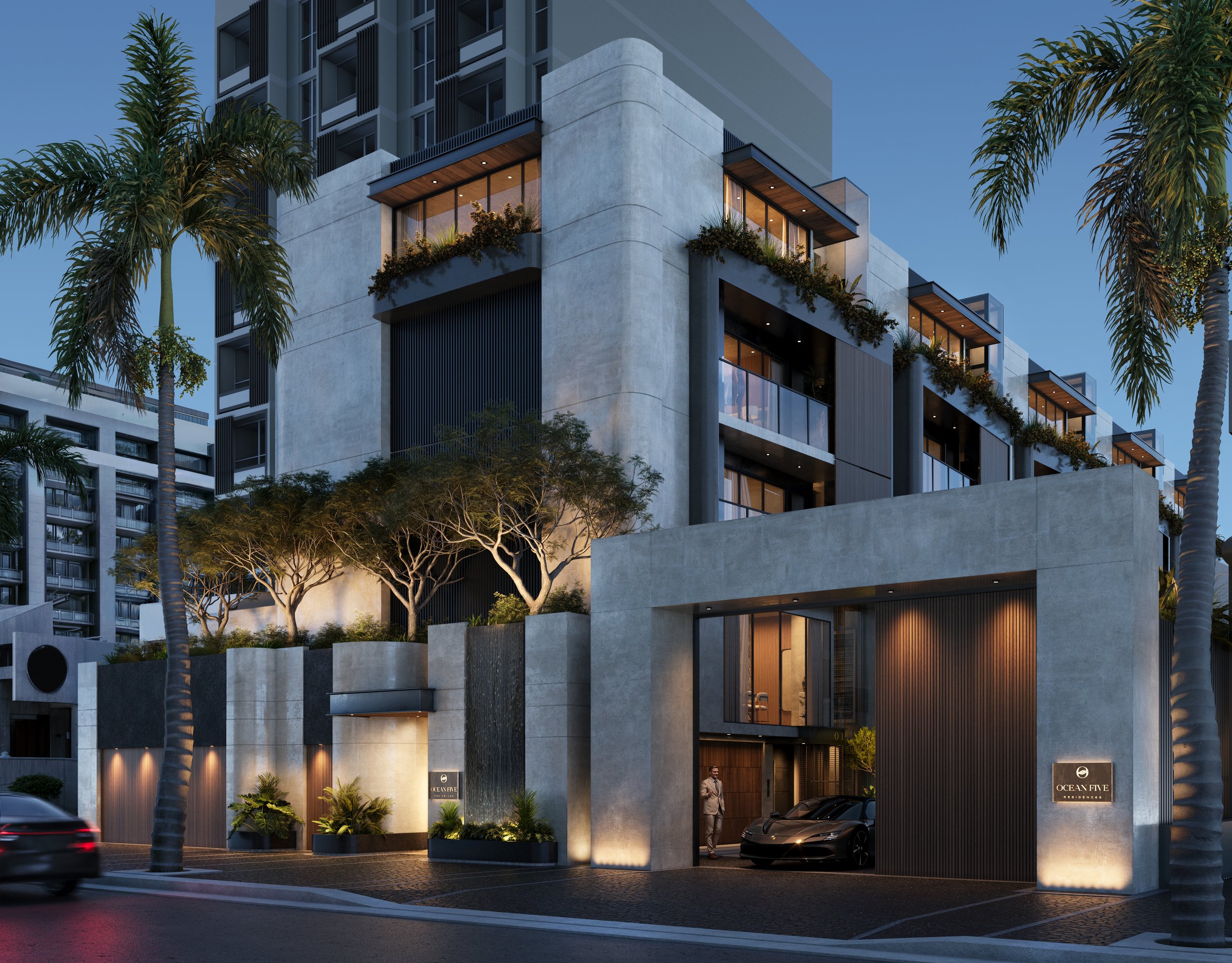 Modern multi-story residential building with outdoor lighting, lush plants, and palm trees in an urban setting at dusk.