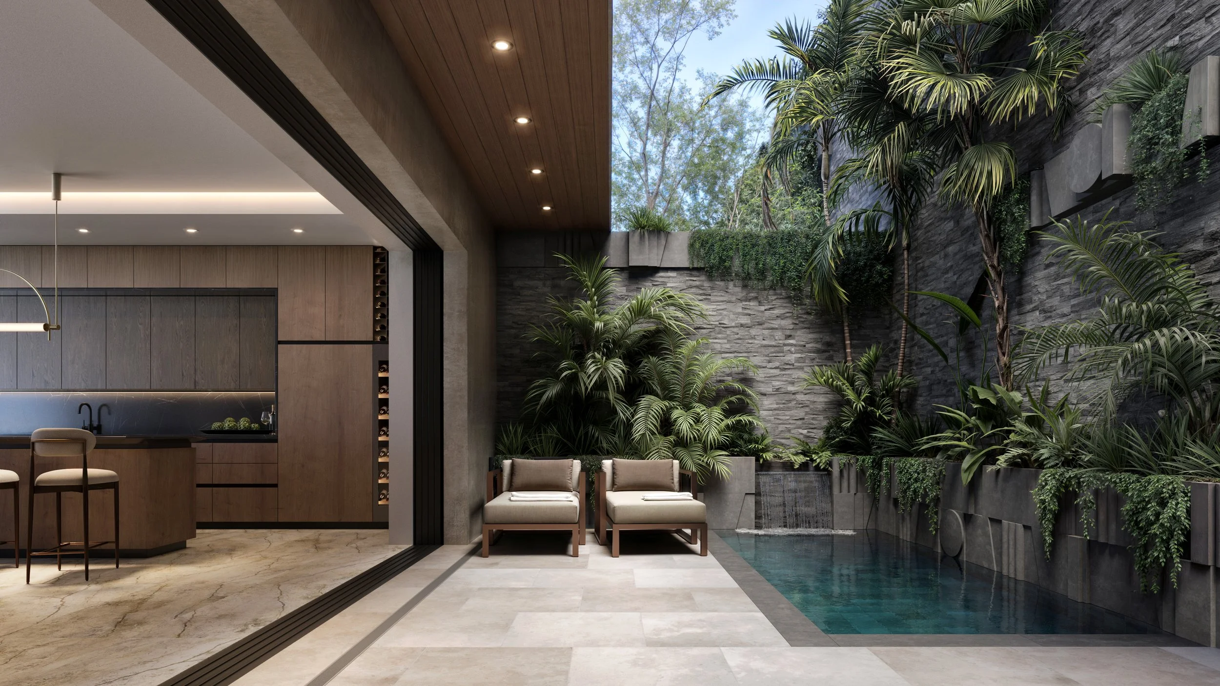Indoor courtyard with a lush green vertical garden, a small water feature with a waterfall, and modern patio furniture including two cream-colored chairs. Part of a kitchen with wooden cabinetry and bar stools is visible on the left. The space featur
