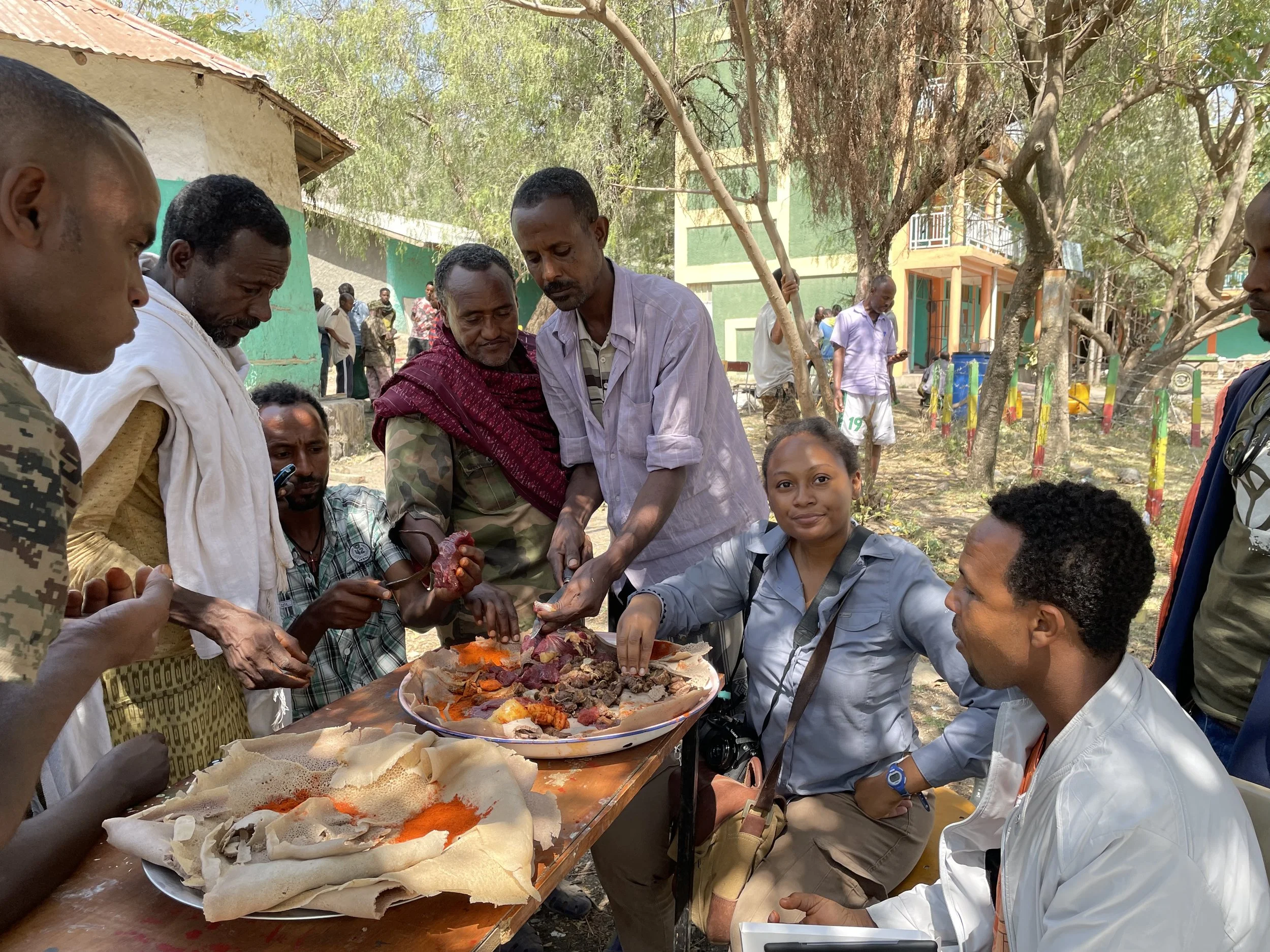 Eating lunch with members of an ethnic militia during the war in Northern Ethiopia. (2022)