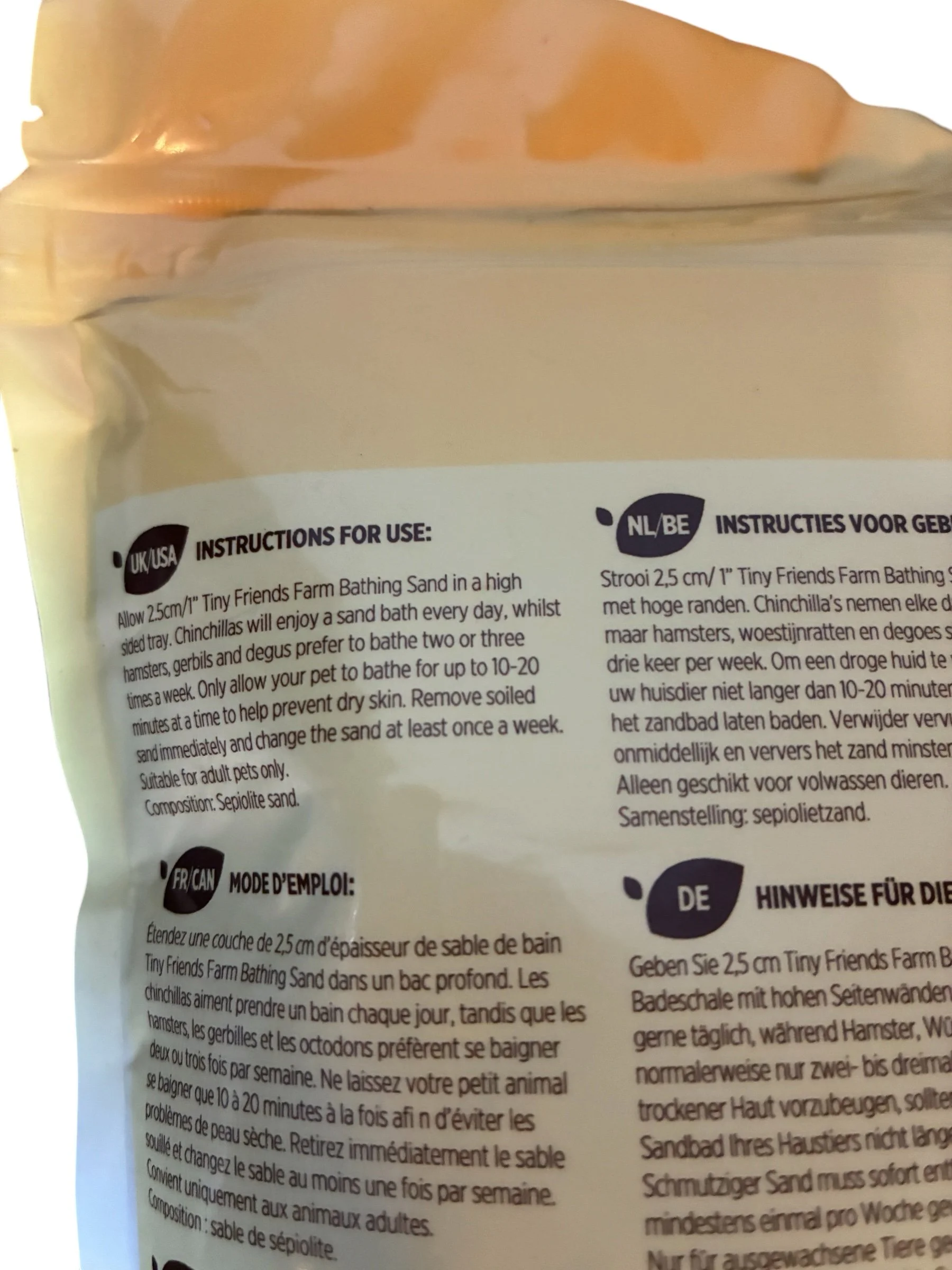 Close-up of Tiny Friends Farm Harry, Charlie & Gerri Bathing Sand highlighting natural bathing sand for hamsters, chinchillas and gerbils to help keep coats clean, soft and healthy.