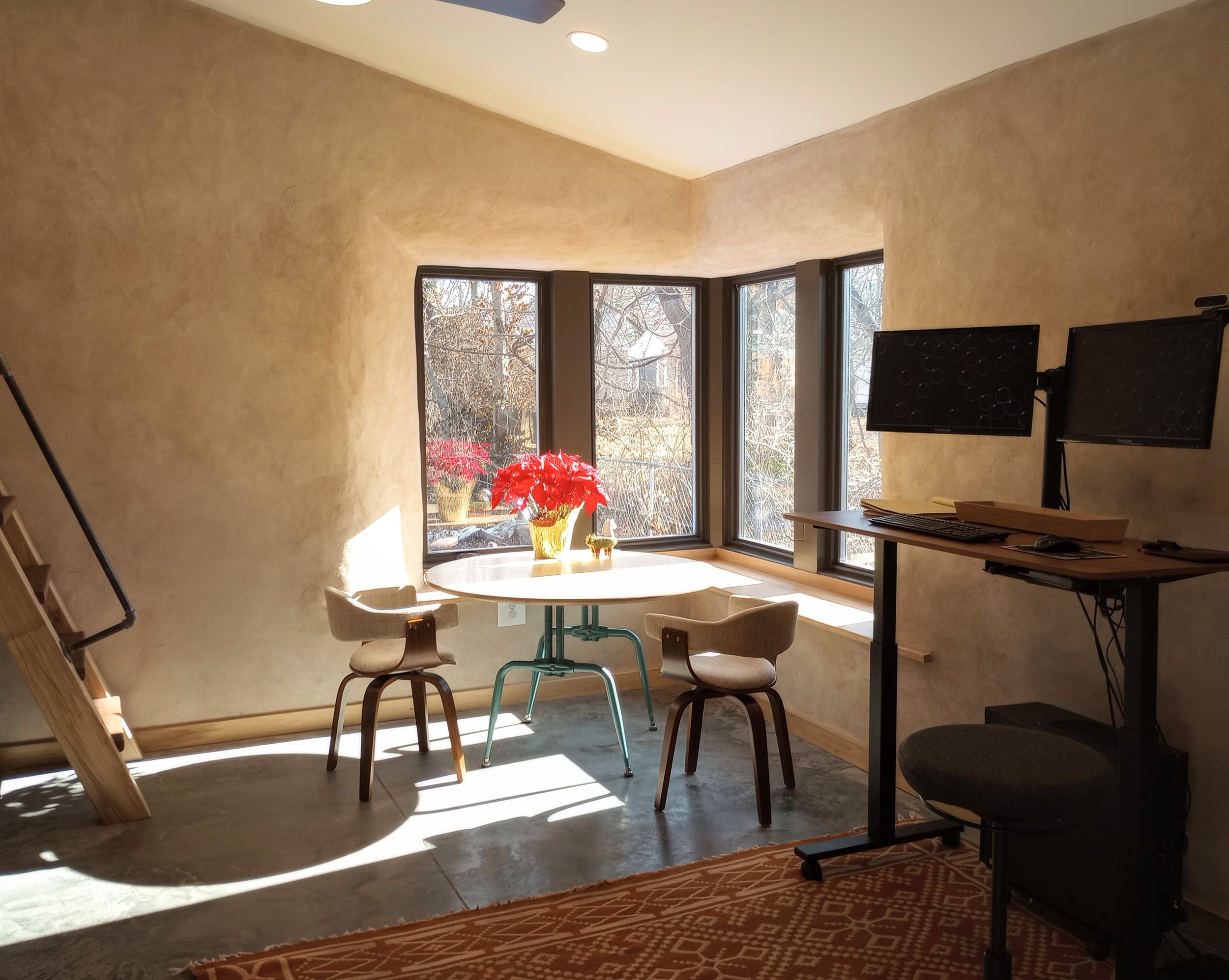 Natural light, plastered walls, straw insulated office building