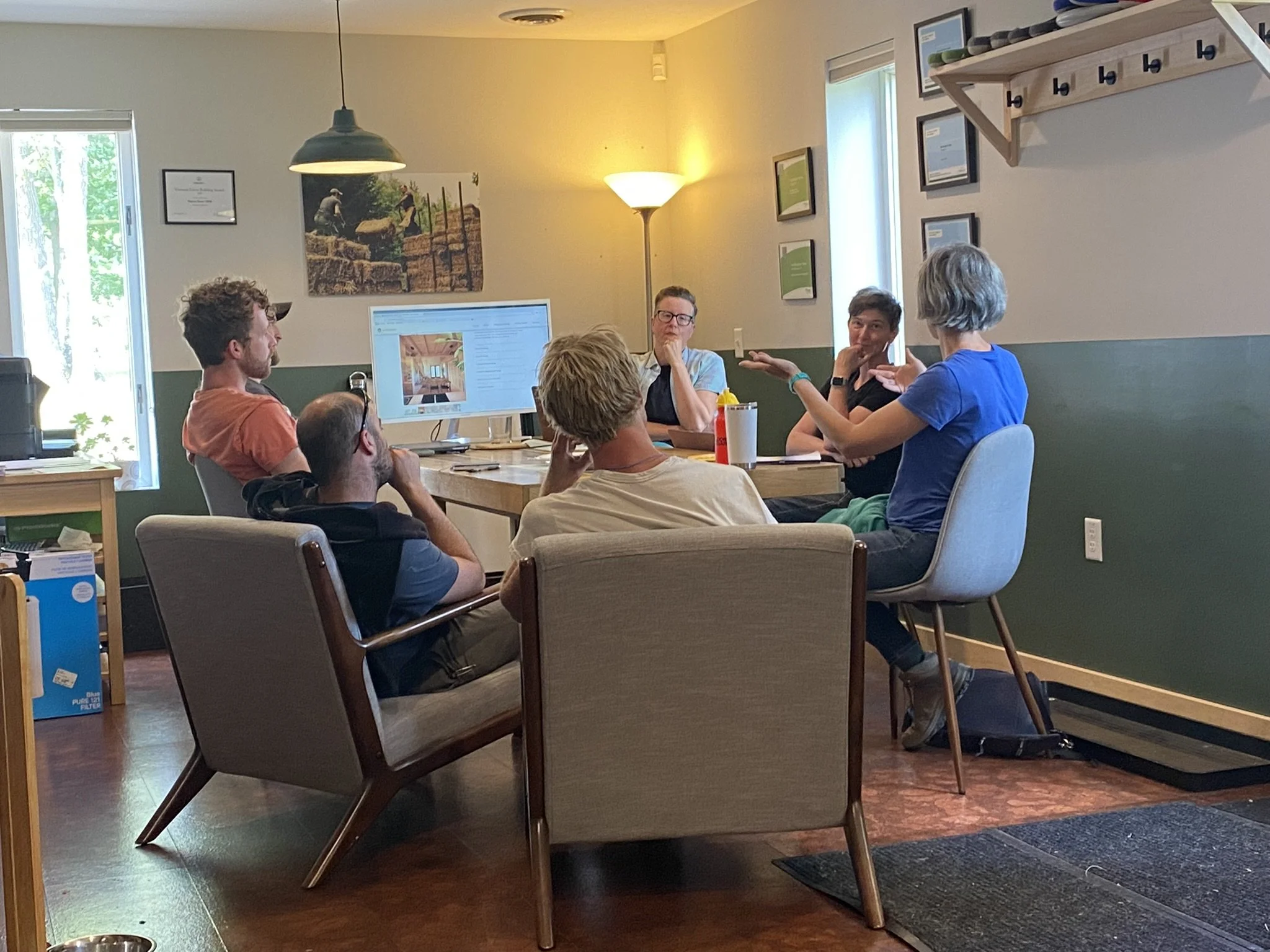 Building Integrity and fellow Seed Collaborative members in discussion sharing prefabricated straw panel fabrication knowledge and resources across North America