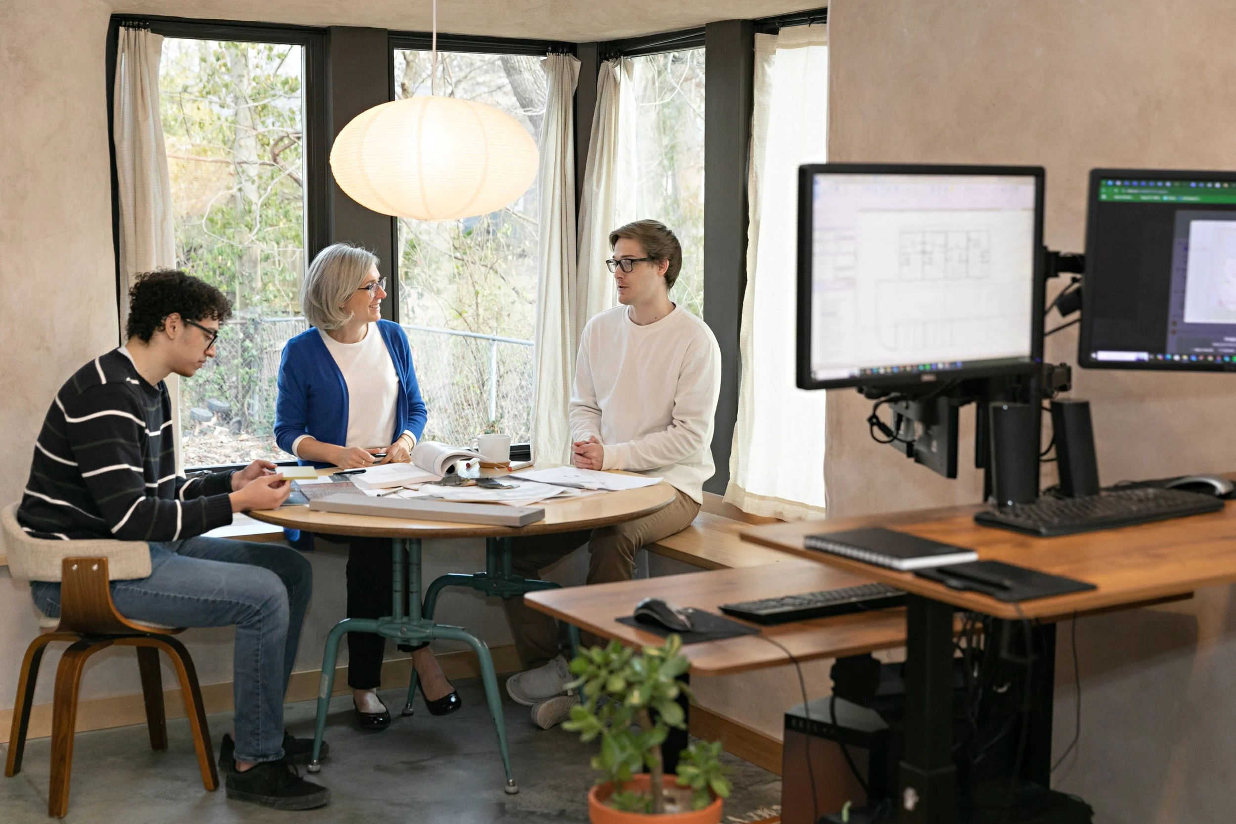 Monarch Architecture staff sit and work in straw insulated office building