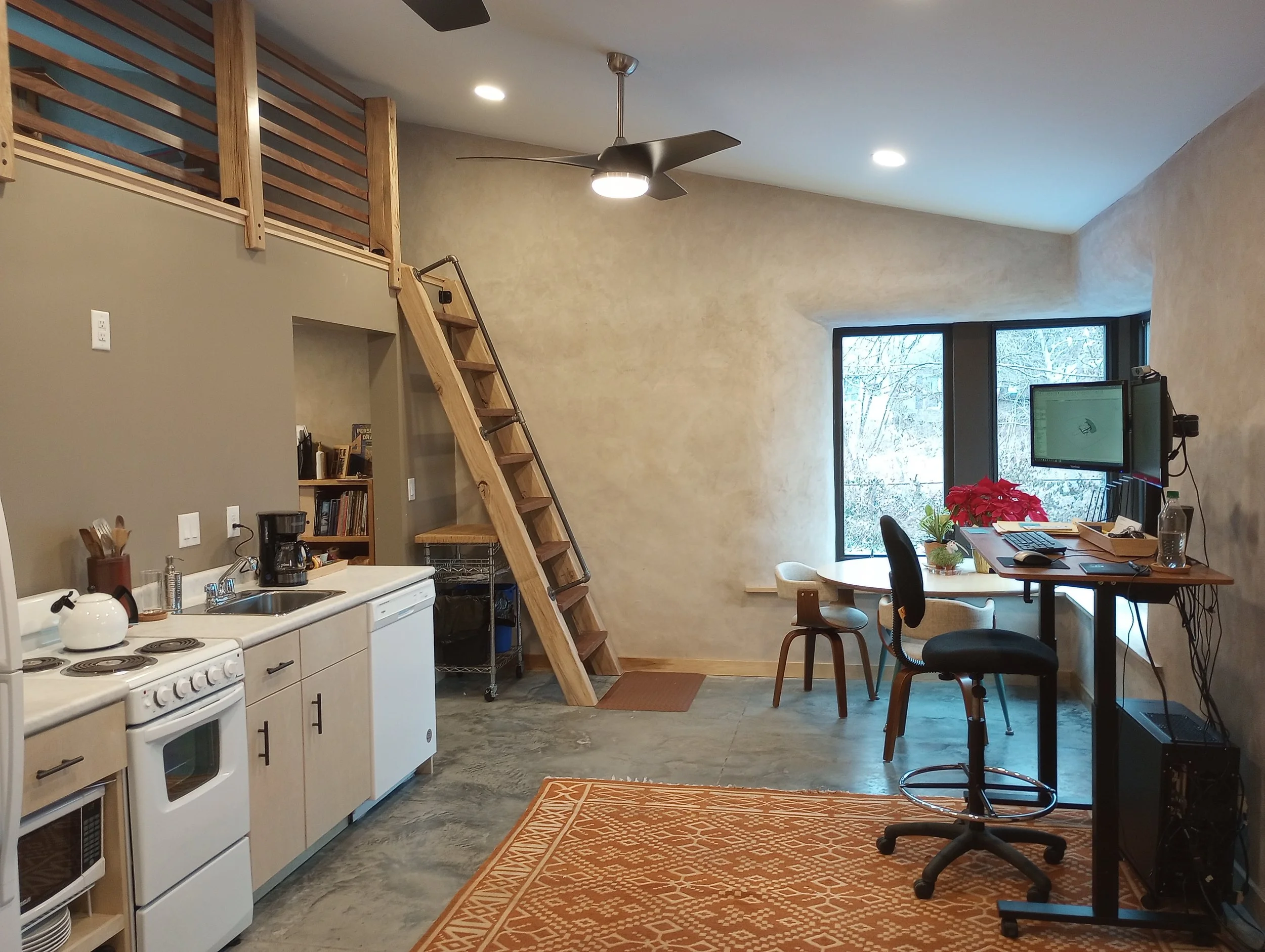 Straw insulated ADU building with kitchenette and desks