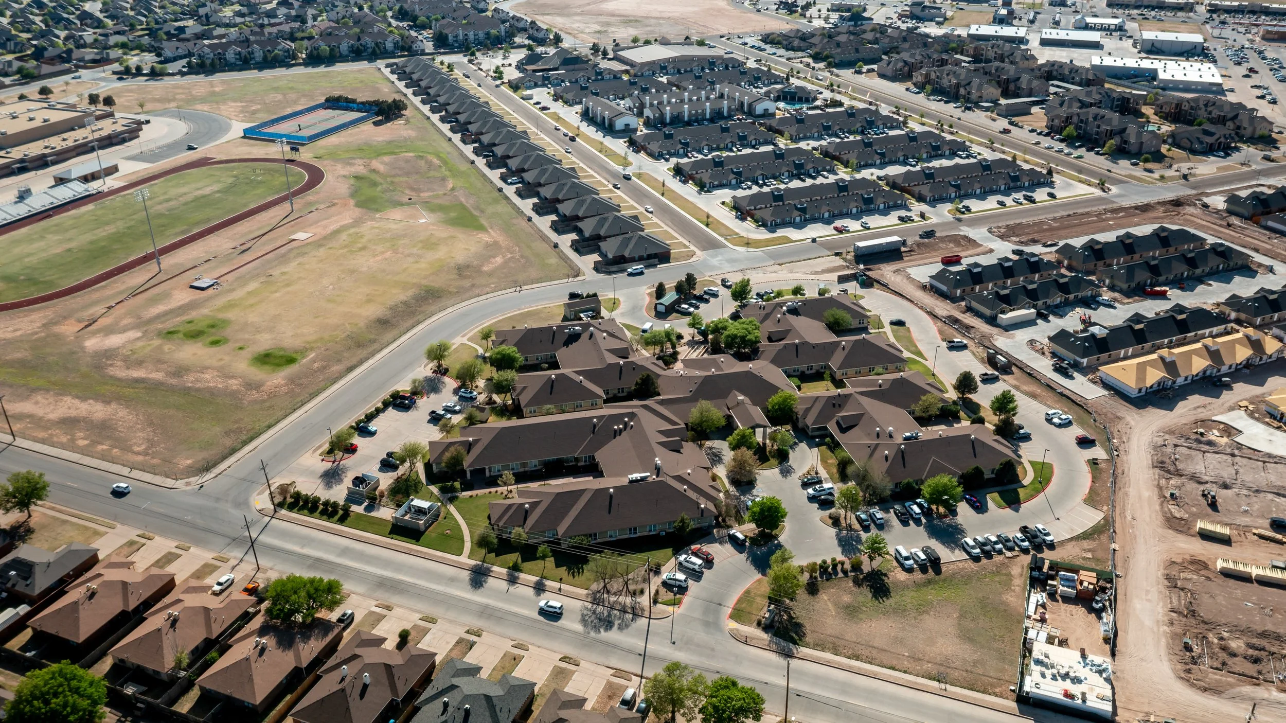 Aerial view of Crown Point Health Suites surrounded by new housing developments.