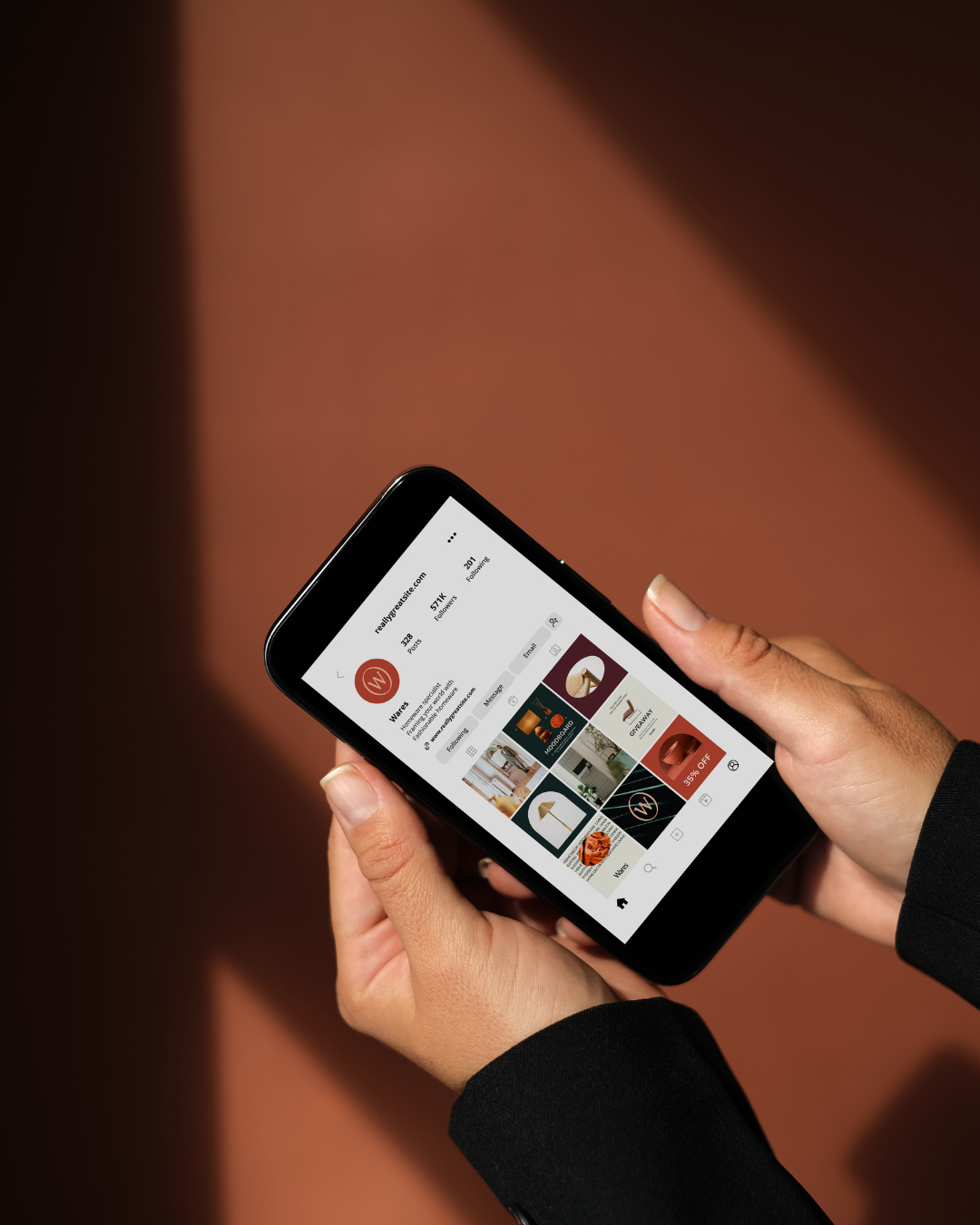 hands holding phone with social media platform on screen