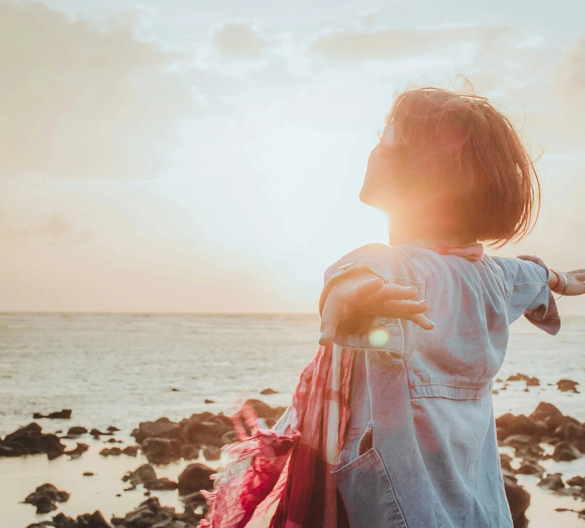 A woman illustrated a sense of freedom, peace, and nervous system restoration through therapy.