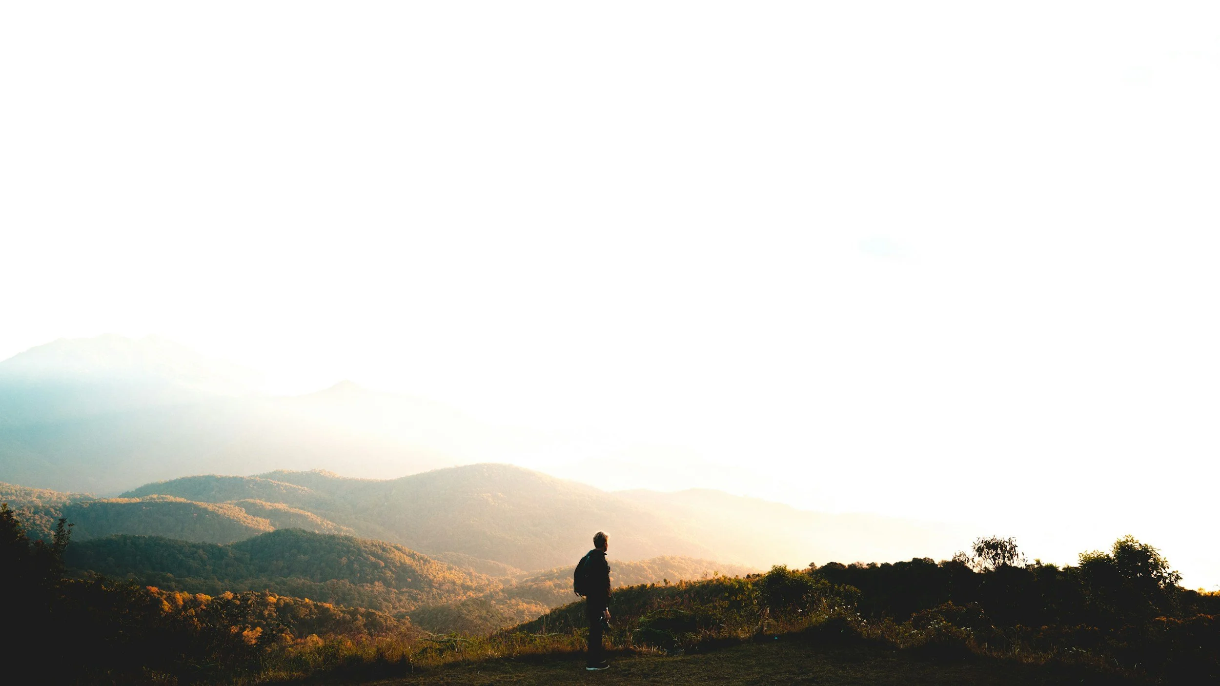 Person overlooking a mountain view.